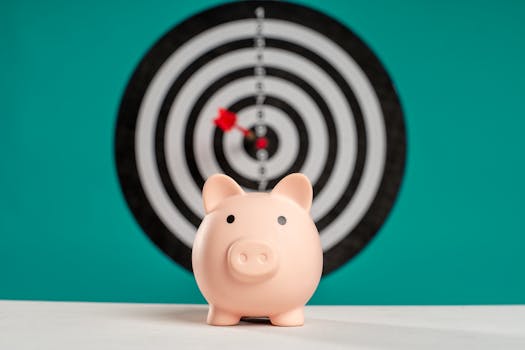 Piggy bank with bullseye dart board symbolizing financial goals and savings.